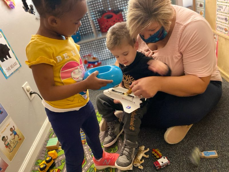 Early Childhood teacher working with toddlers